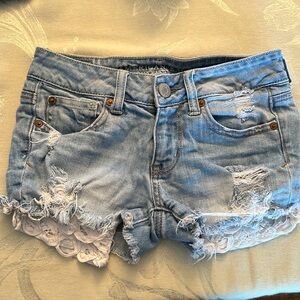 American Eagle jean shorts with white designed pockets